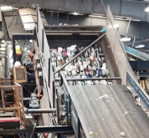 Plastic bags tangled in the machinery, Texas Disposal Systems recycling sorting facility, Creedmoor, TX