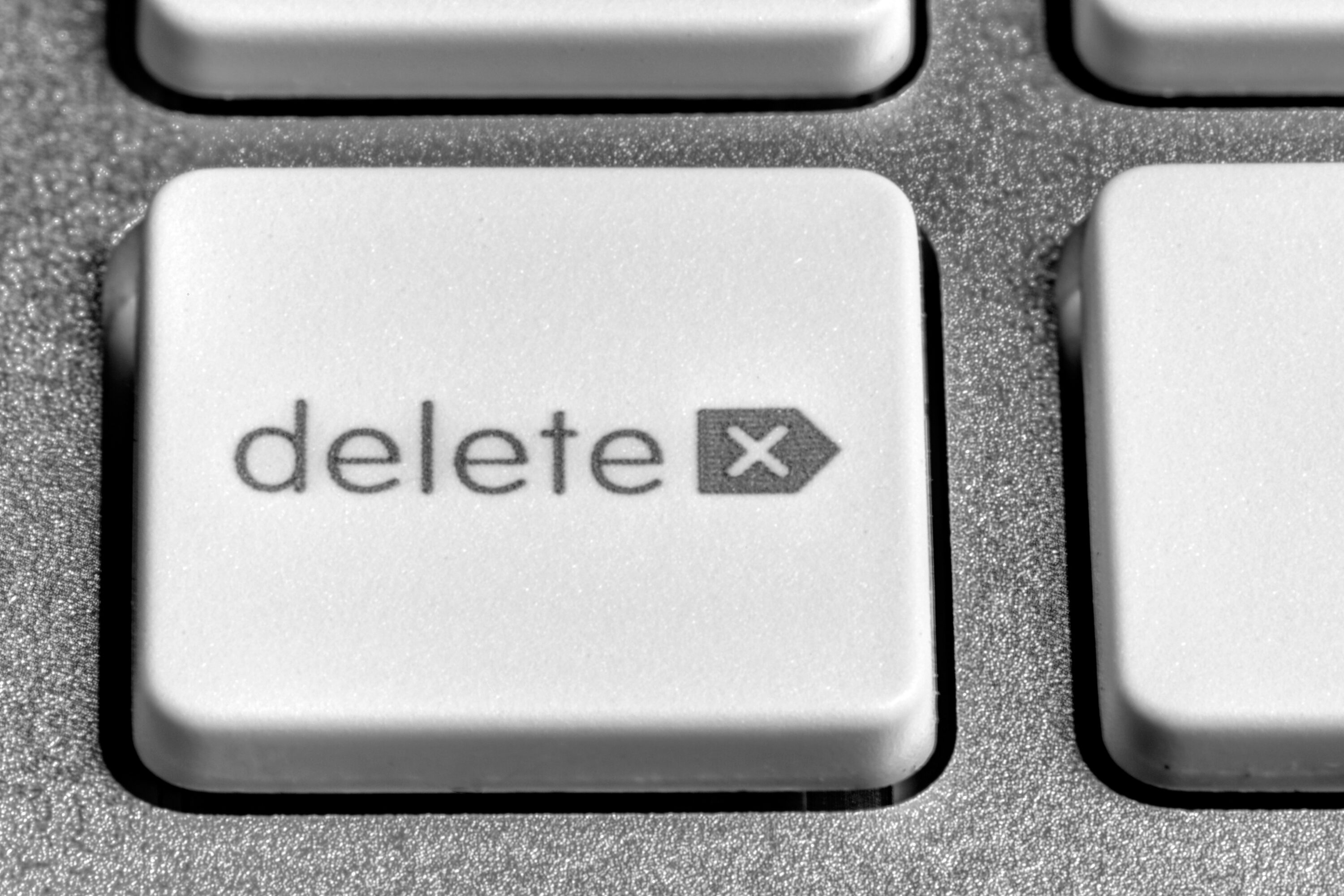 A photograph of a delete button on a computer keyboard