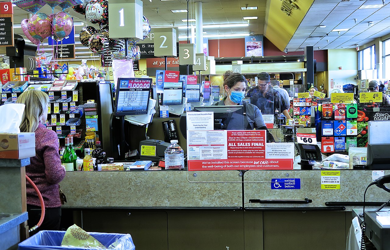 cashier wearing mask at supermarket